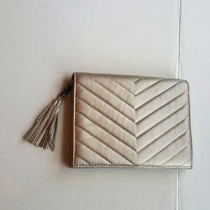 Neiman Marcus muted gold clutch quilted geometrical minimalist fringe tassel